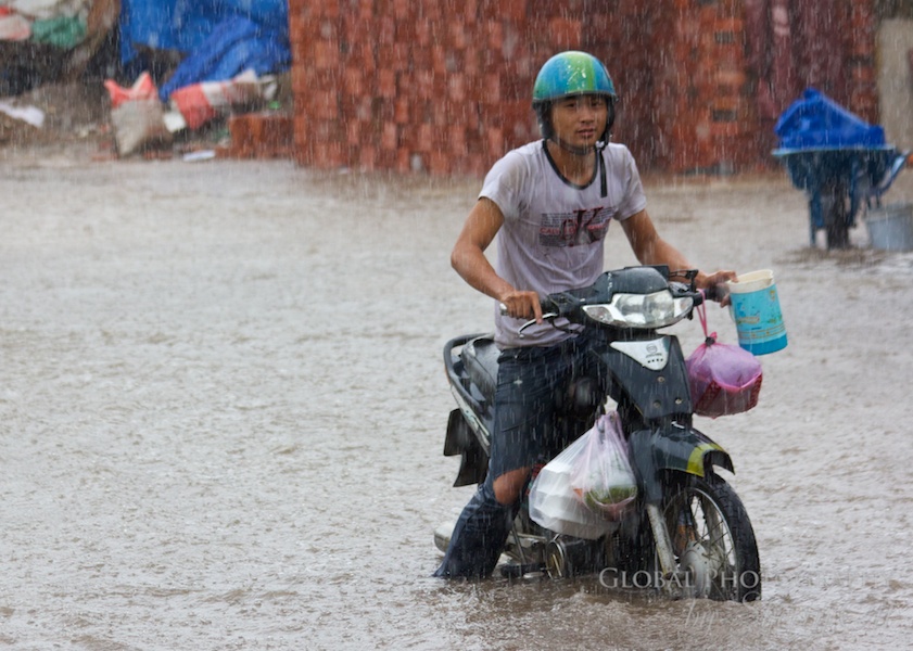 Stuck in the street flood – but still a smile on his face!