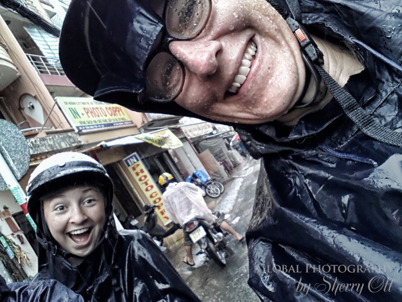Evie and I on the back of our motorbikes enjoying the rainy experience!